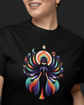 Person wearing a black t-shirt with a colorful graphic design on a dark background